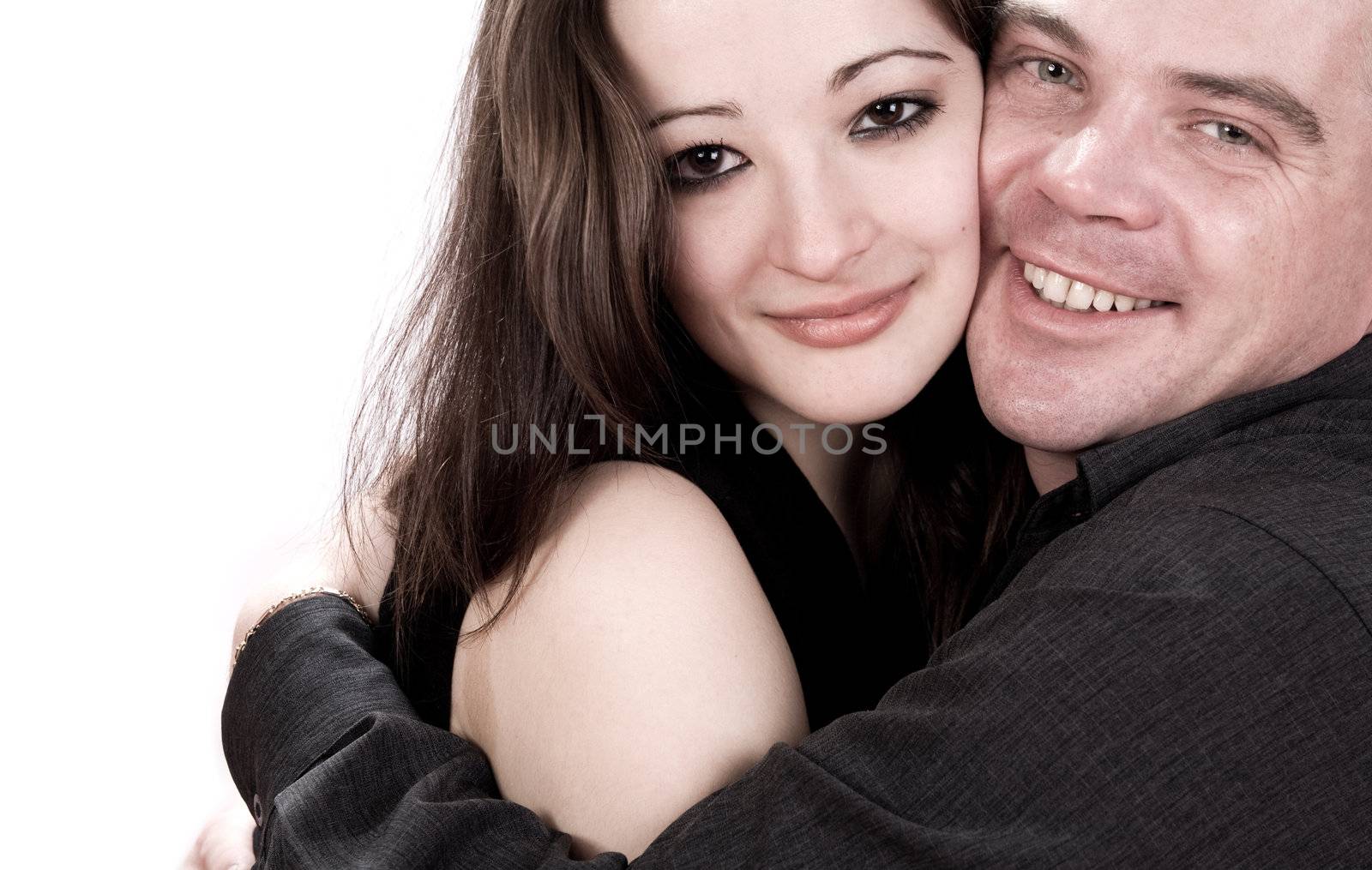 Studio shot of young loving couple caring