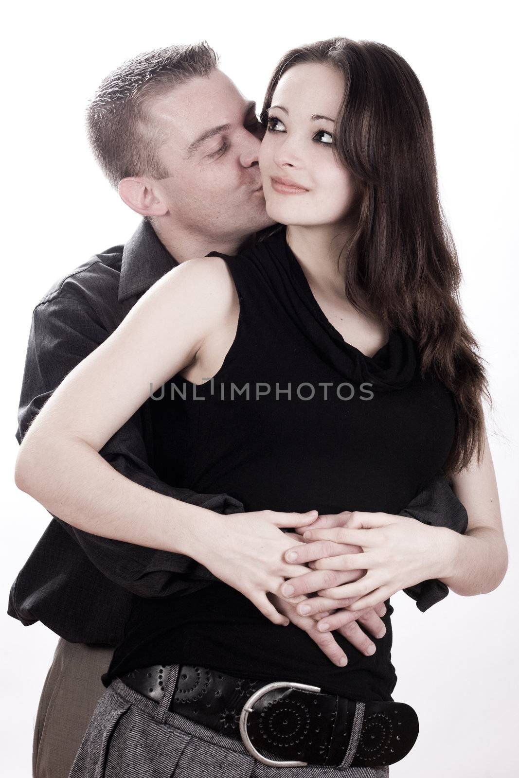 Studio shot of you loving couple kissing