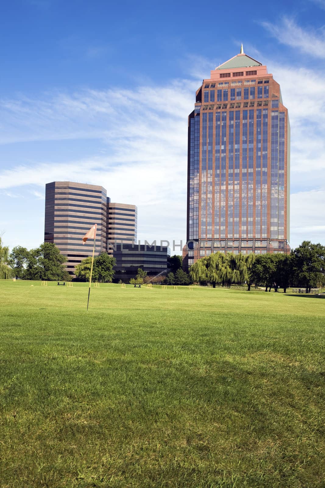 Golf Course in front of skyscrapers by benkrut