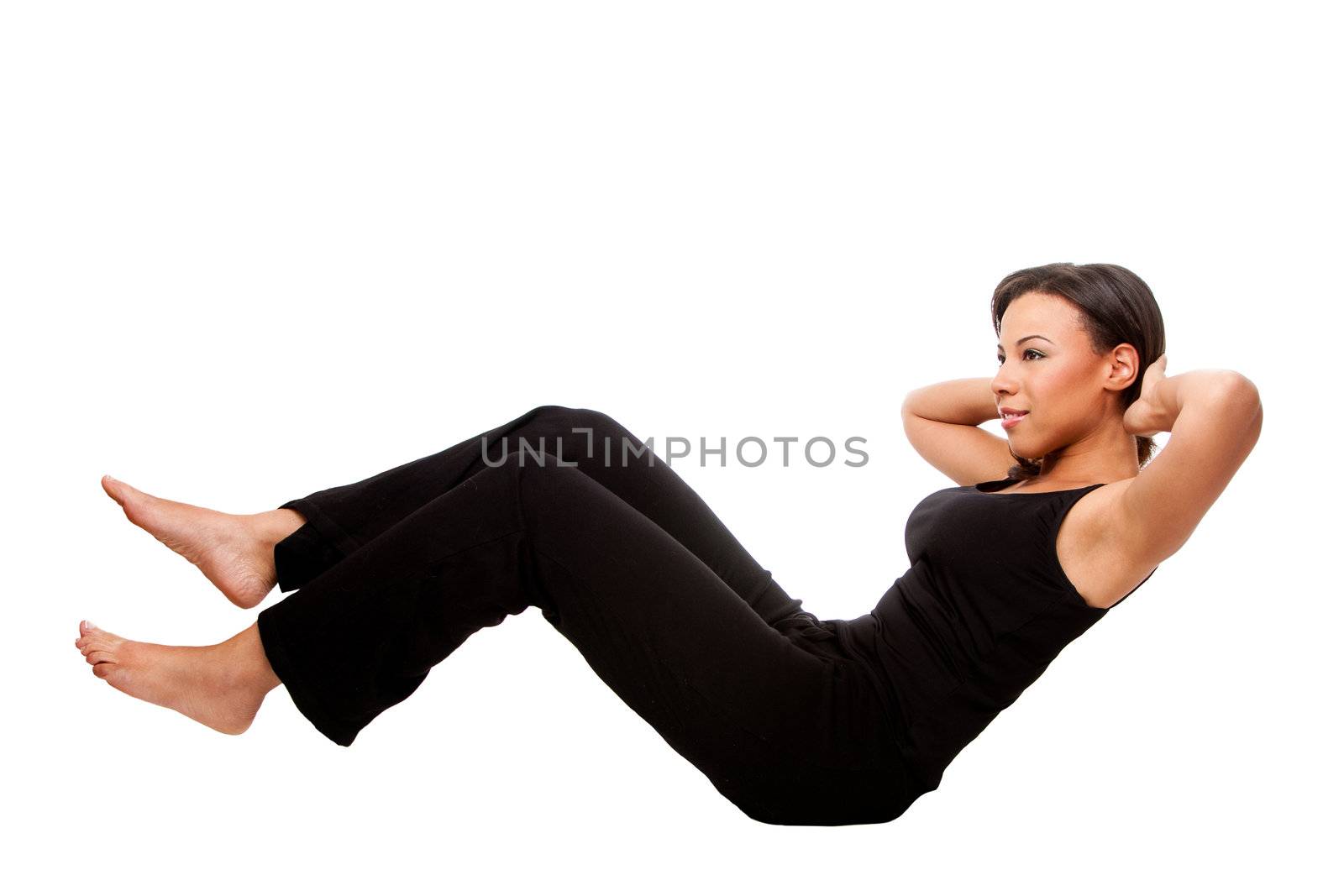 Young happy beautiful woman during fitness time exercising for health  staying in shape doing crunches situps, in black, isolated.