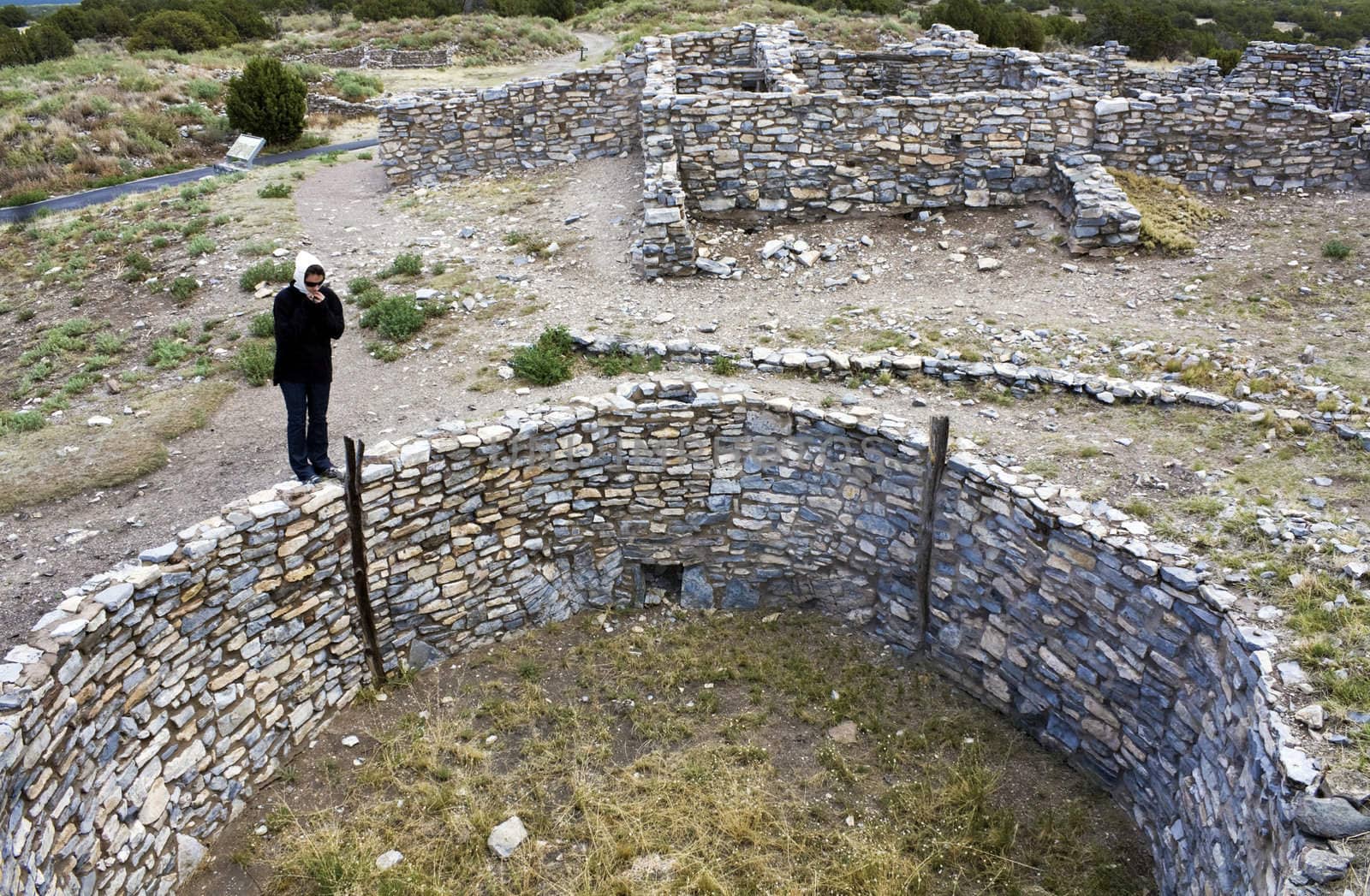 Girl exploring Gran Quivira Ruins in New Mexico, USA.