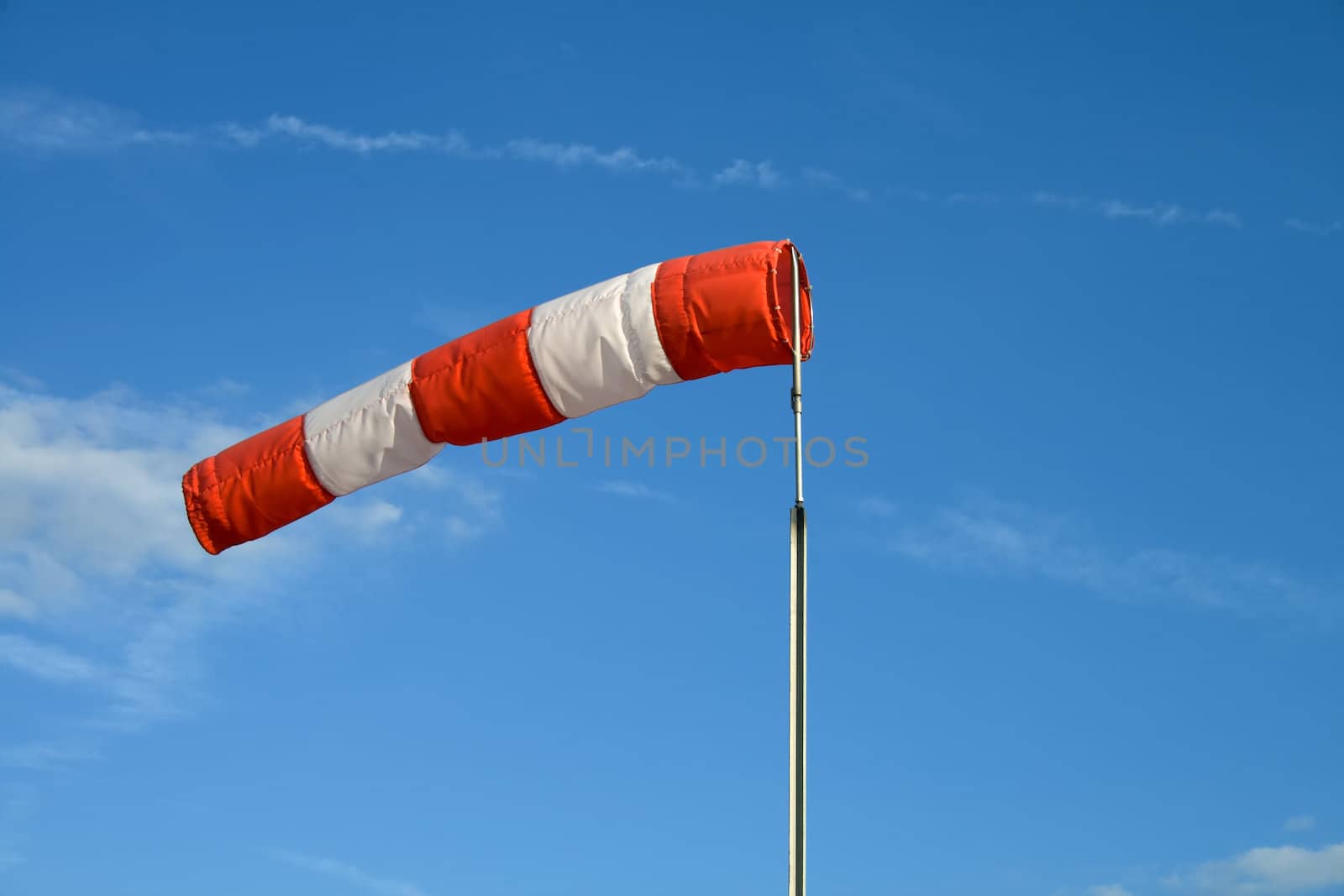 Wind sock in front of blue sky