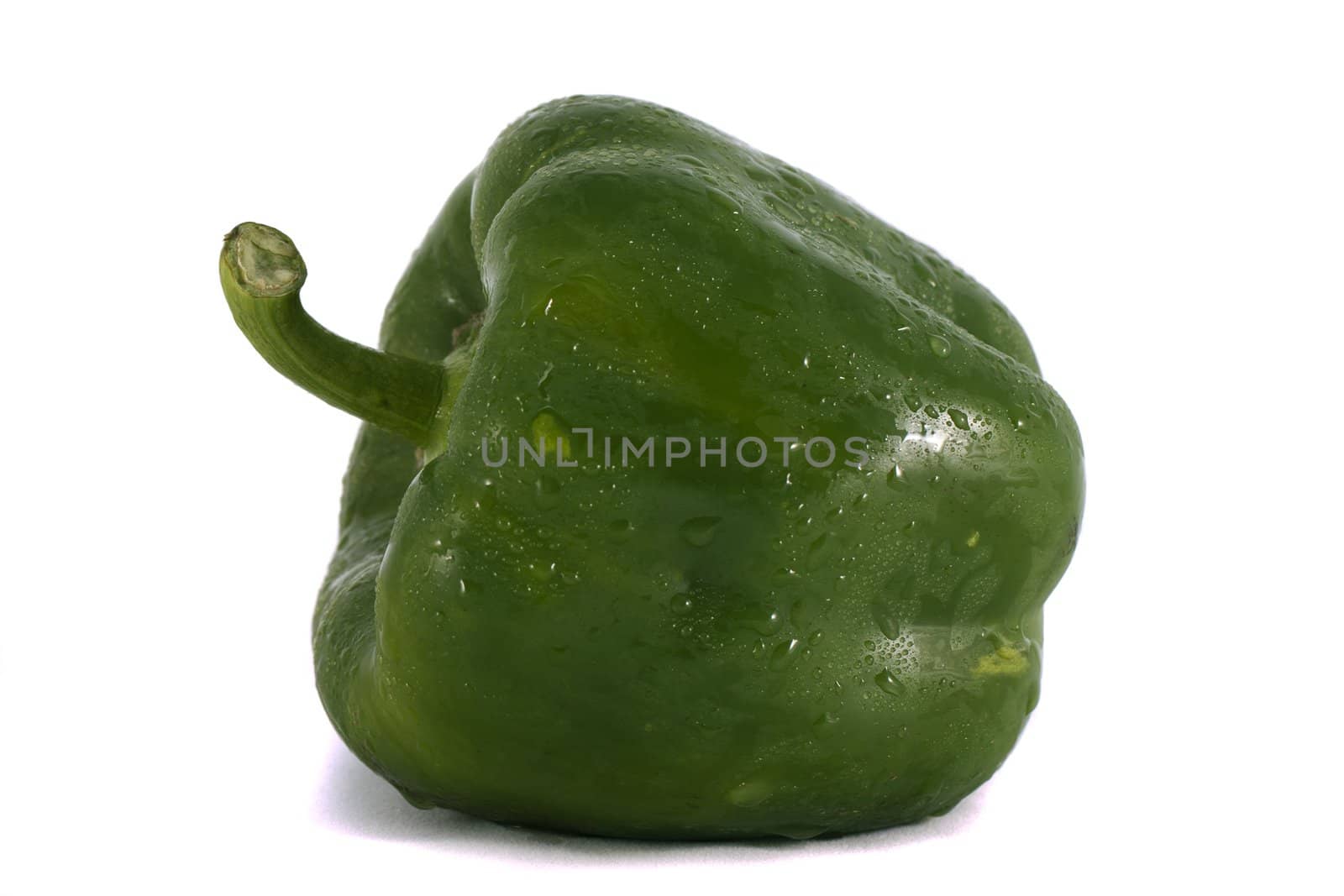 Close view of a isolated green bell pepper on a white background