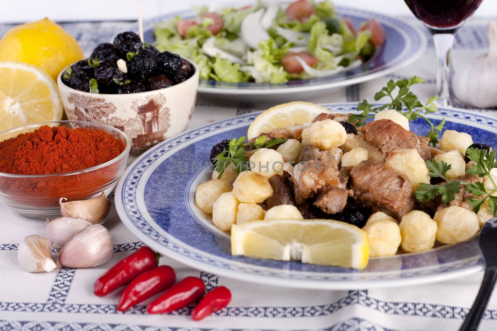 Close up view of a Portuguese meal of cooked meat with potatoes.