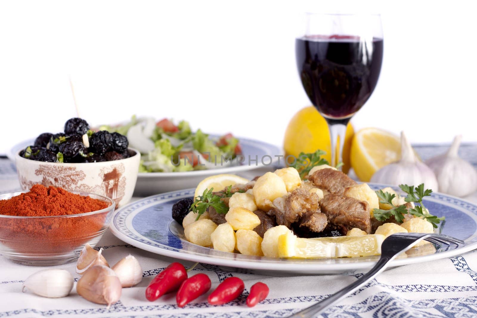 Close up view of a Portuguese meal of cooked meat with potatoes.