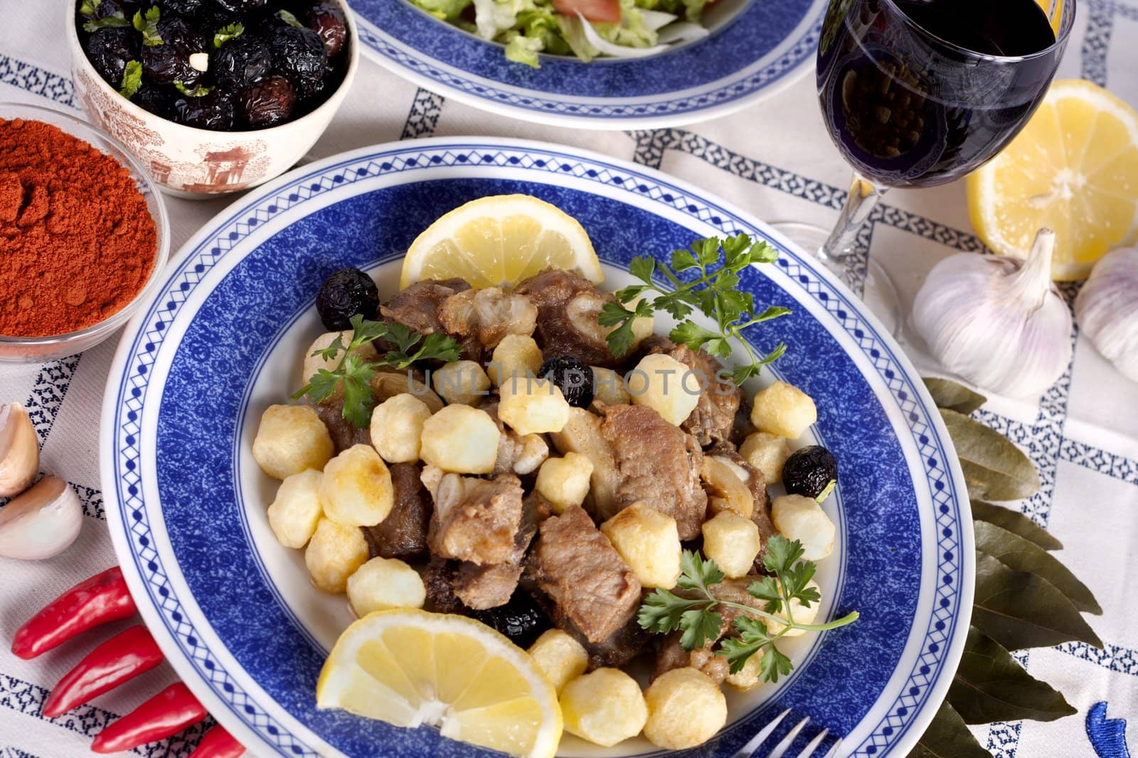 Close up view of a Portuguese meal of cooked meat with potatoes.