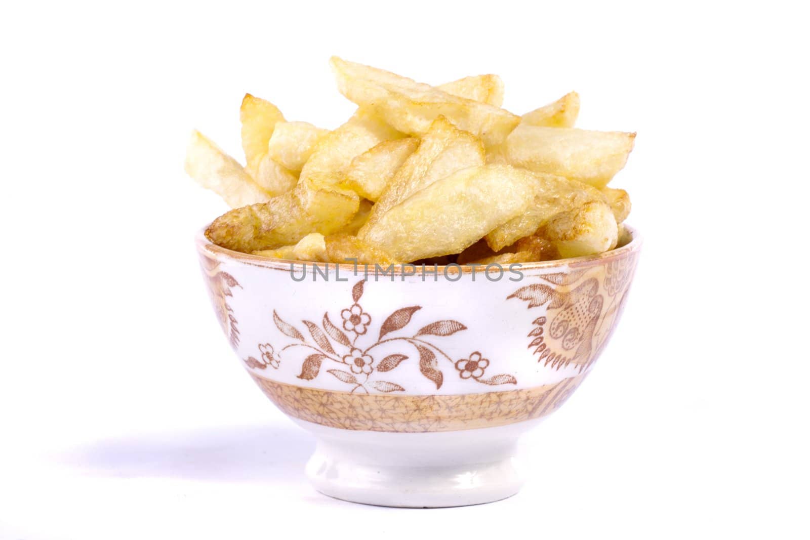 Close up view of a bunch of fried potatoes in slices. 