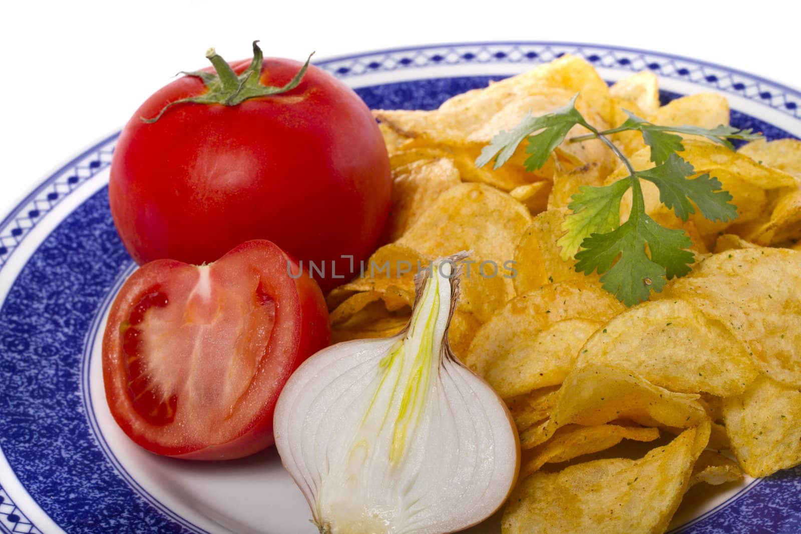 Close view of a single potato chip isolated on a white background.