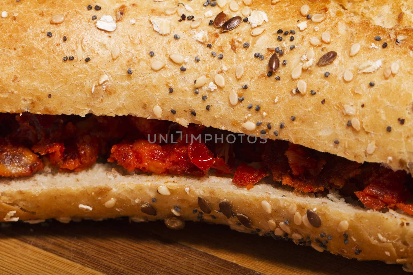 View of a dish of fresh sandwich with seeds filled with Portuguese chorizo.