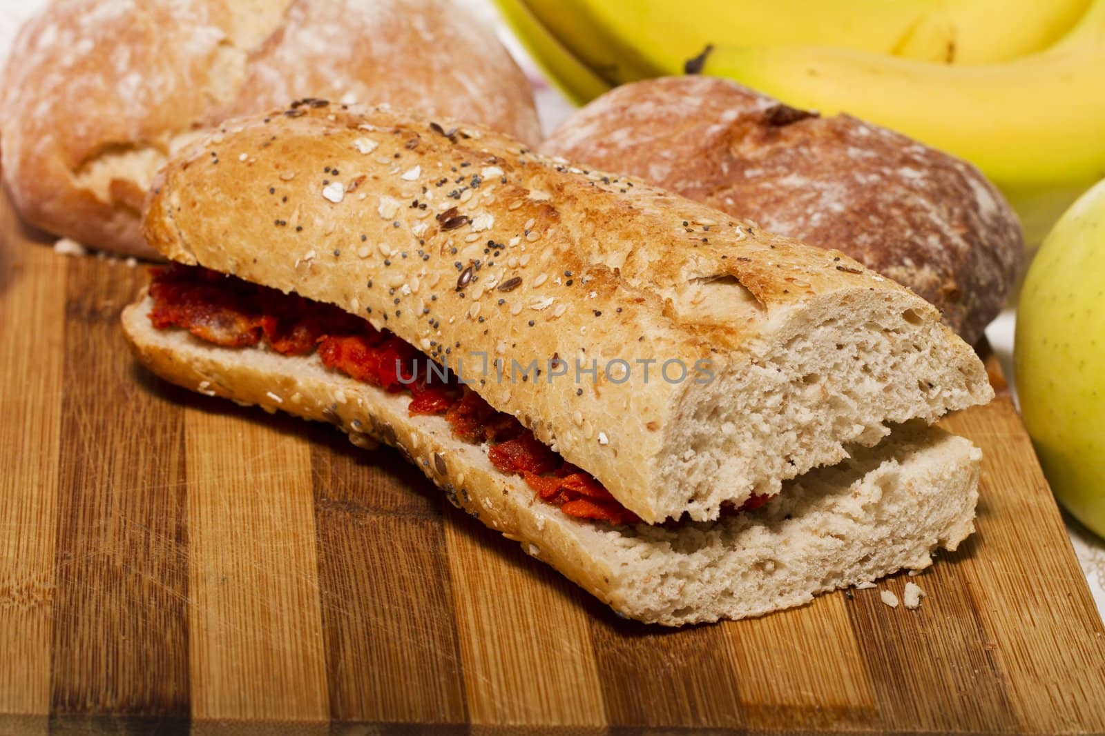 View of a dish of fresh sandwich with seeds filled with Portuguese chorizo.