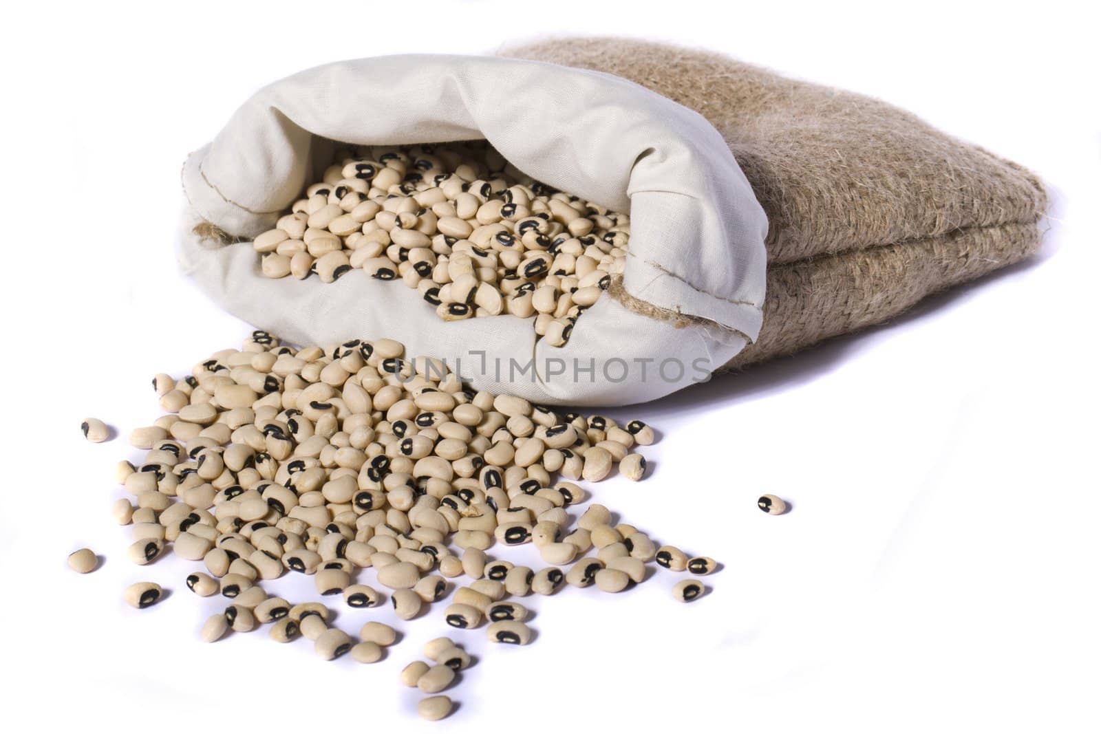 View of a sack of black eyed peas beans isolated on a white background.