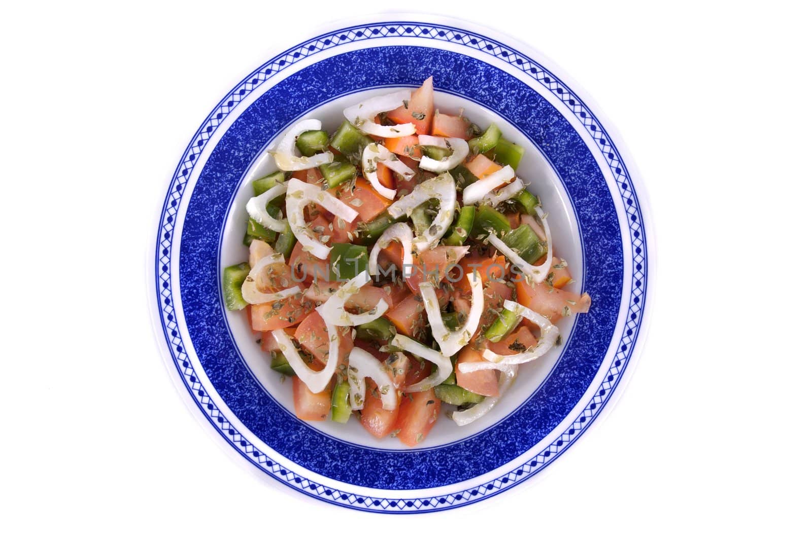 Detail view of a fresh made Mediterranean salad isolated on a white background.
