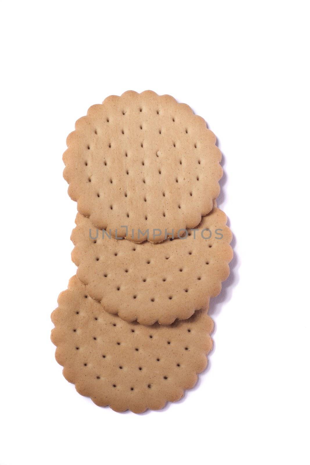 View of three round biscuits isolated on a white background.