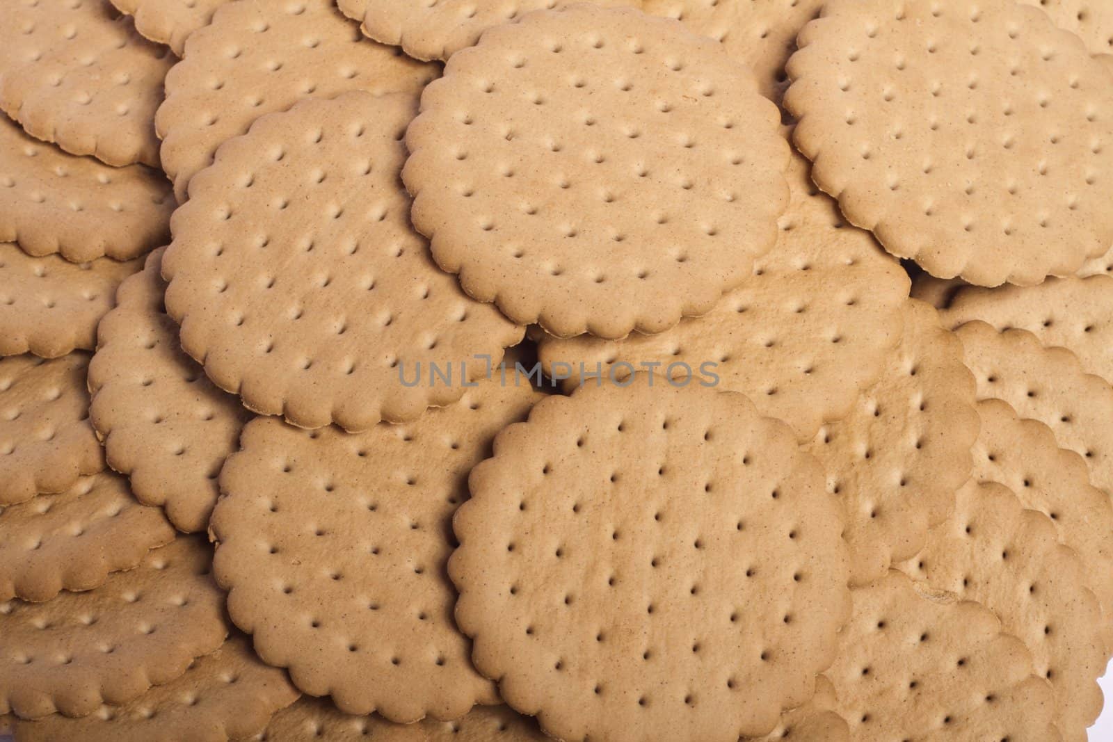 View of many round biscuits stacked on top of each other.