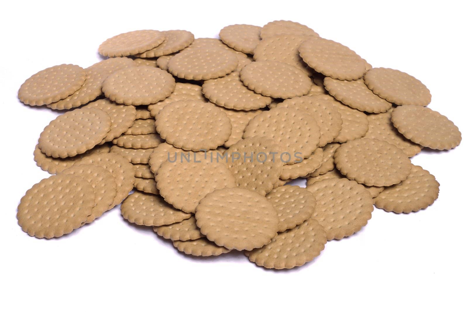 View of many round biscuits isolated on a white background.