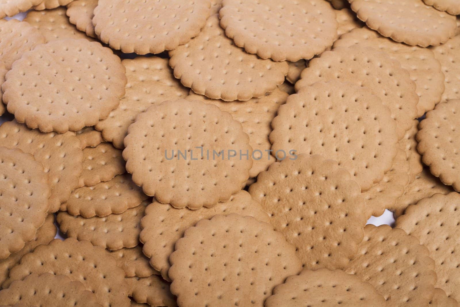 View of many round biscuits stacked on top of each other.