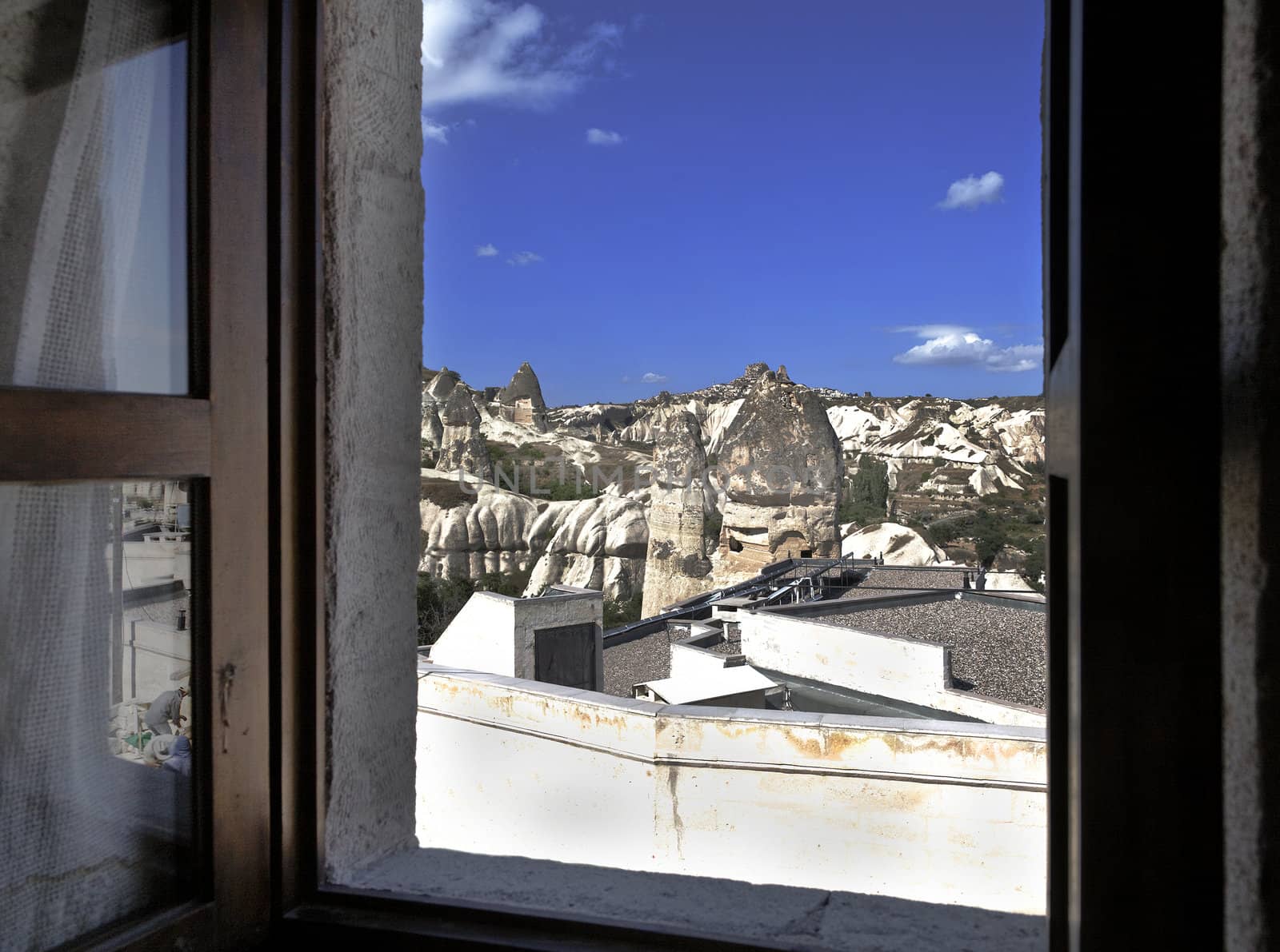 Goreme Valley and Uchisar on the hill, limestone fairy chimneys and terrain from a bedroom window, landscape with crop space and copy area