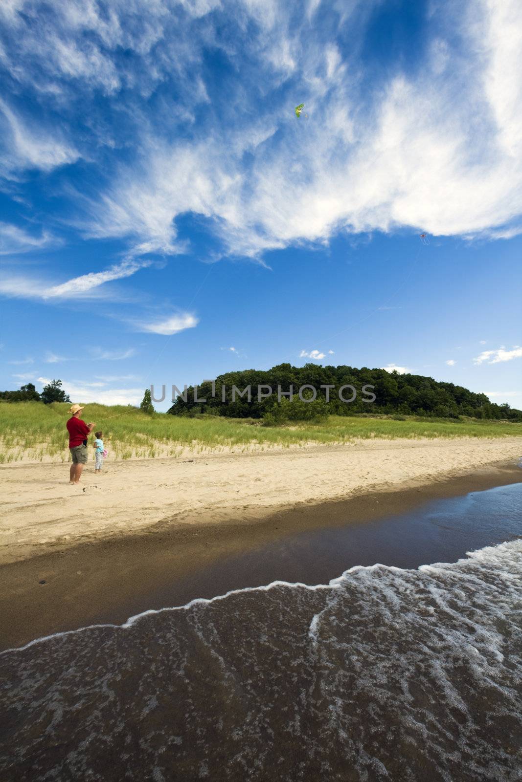 Flying Kites on the beach by benkrut