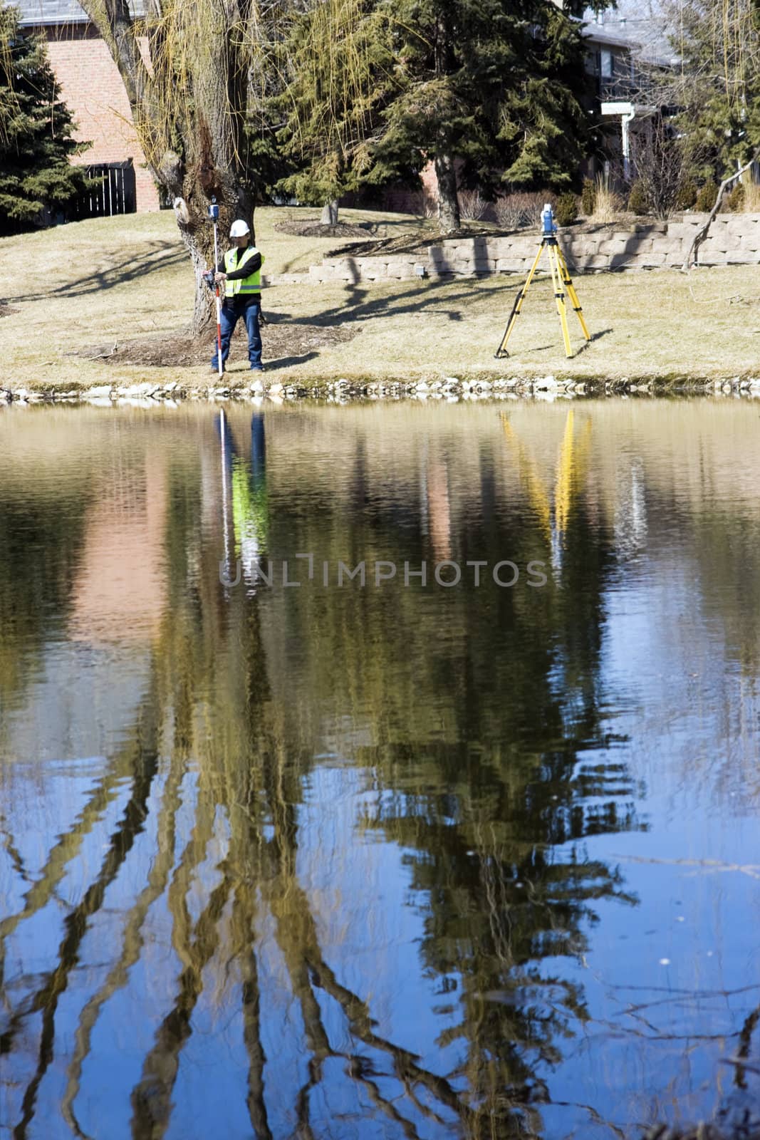 Taking measurements by the lake - spring time.
