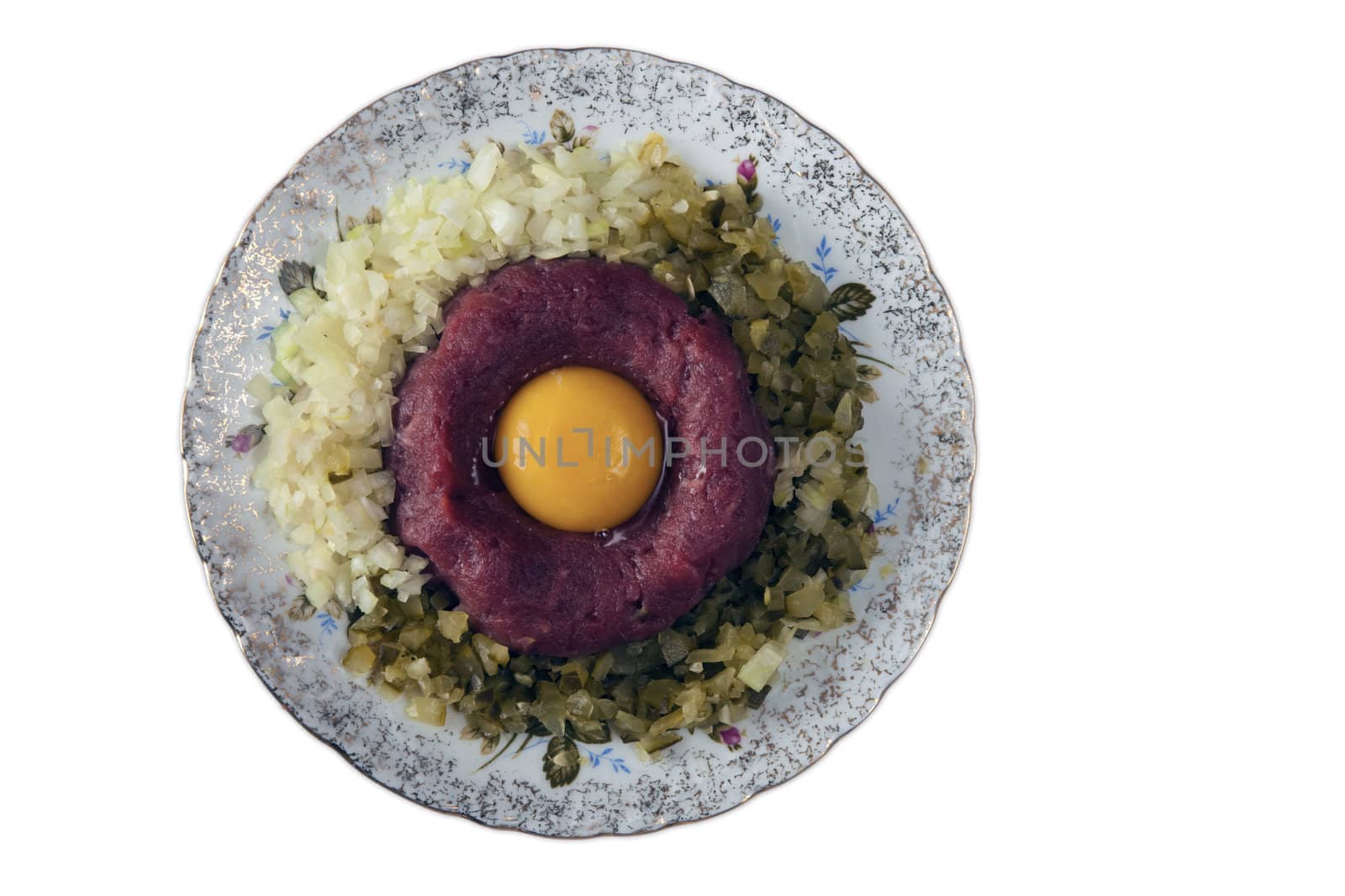 Tatar - raw beef with onions, pickles, yolk and spices.