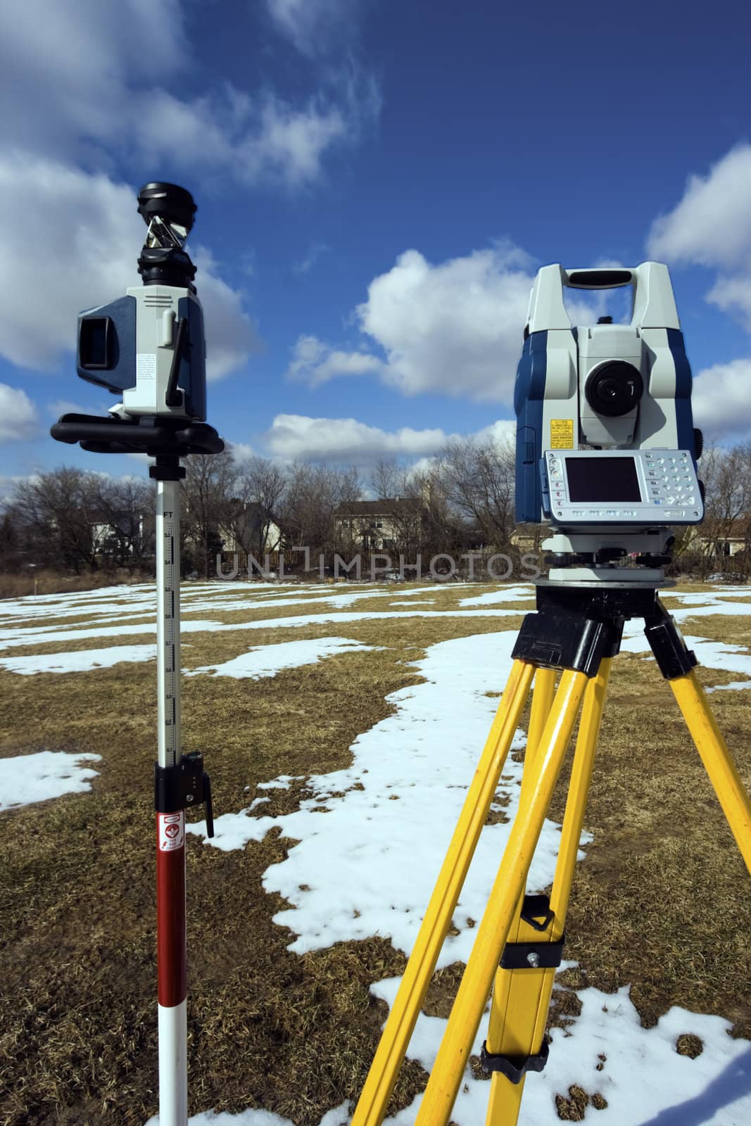 Winter surveying - robotic station set in the field.