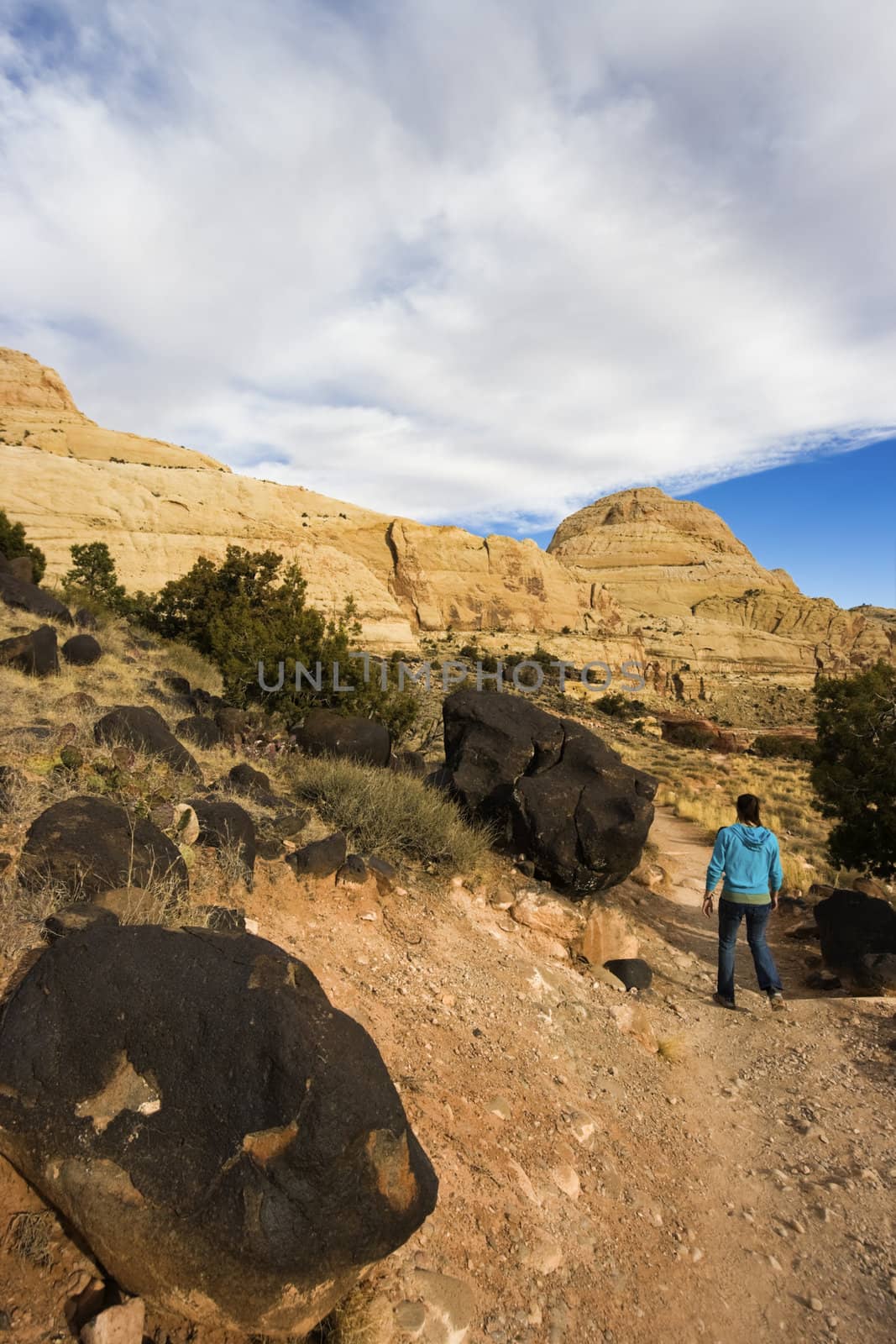 Tourisit running in Capitol Reef National Park by benkrut