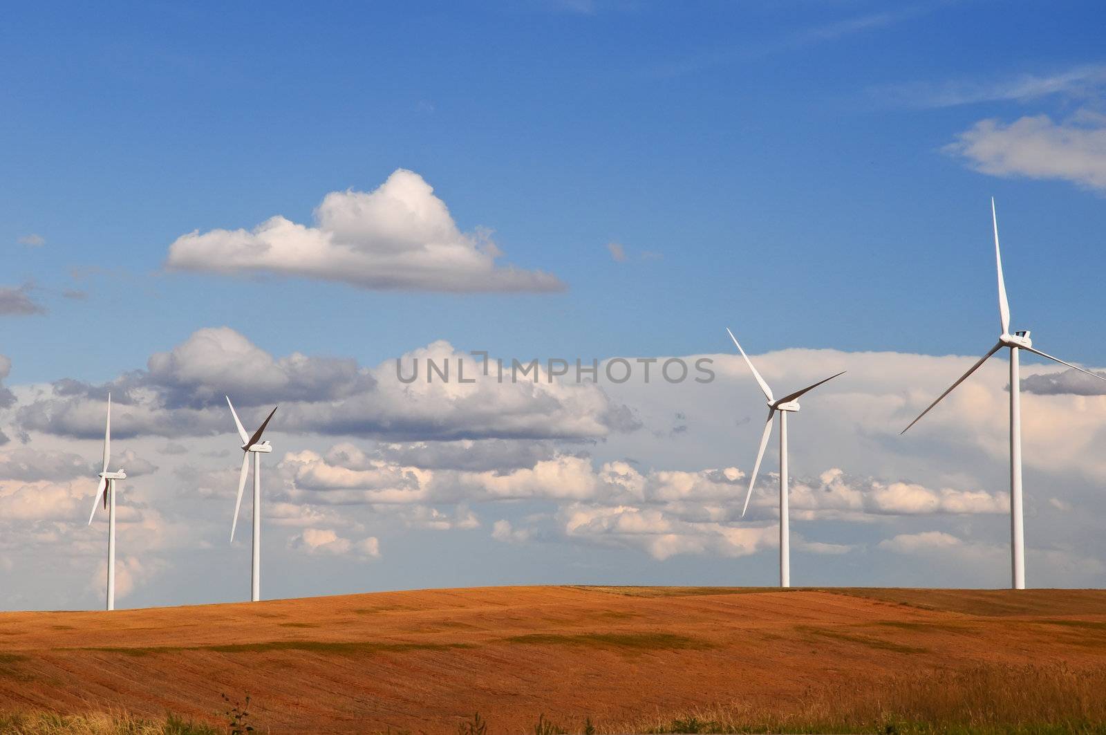 Large wind turbines gathering electricity out of the wind in eastern Colorado, USA