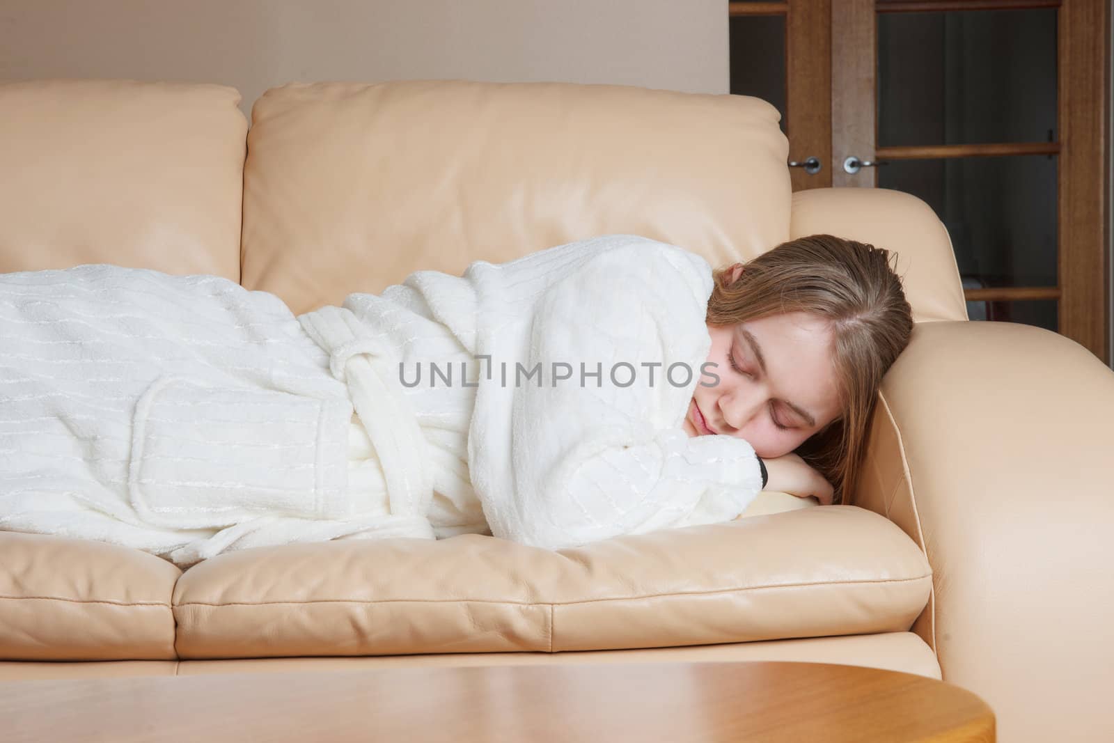 a young woman asleep on the sofa