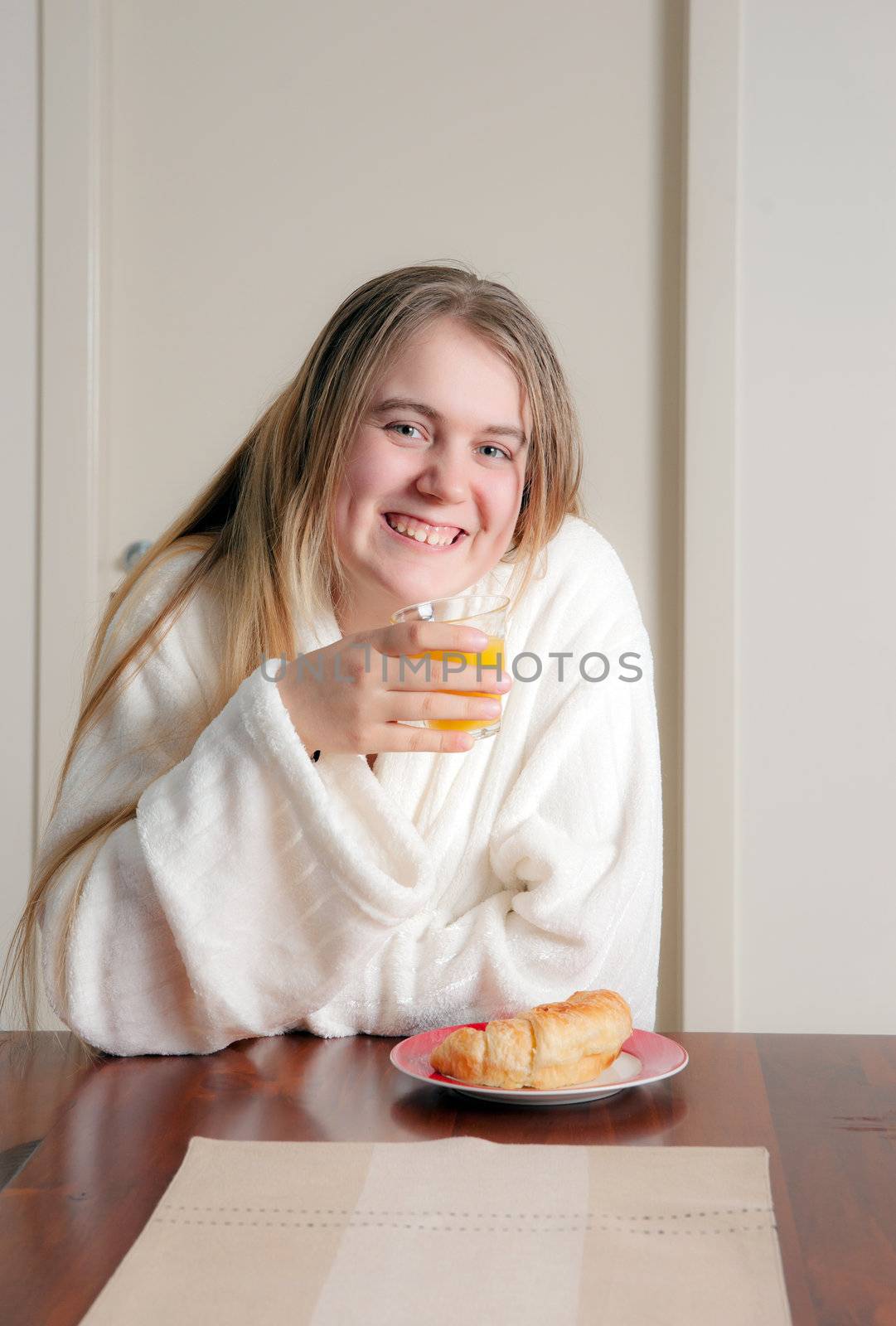 young woman having breakfast by clearviewstock