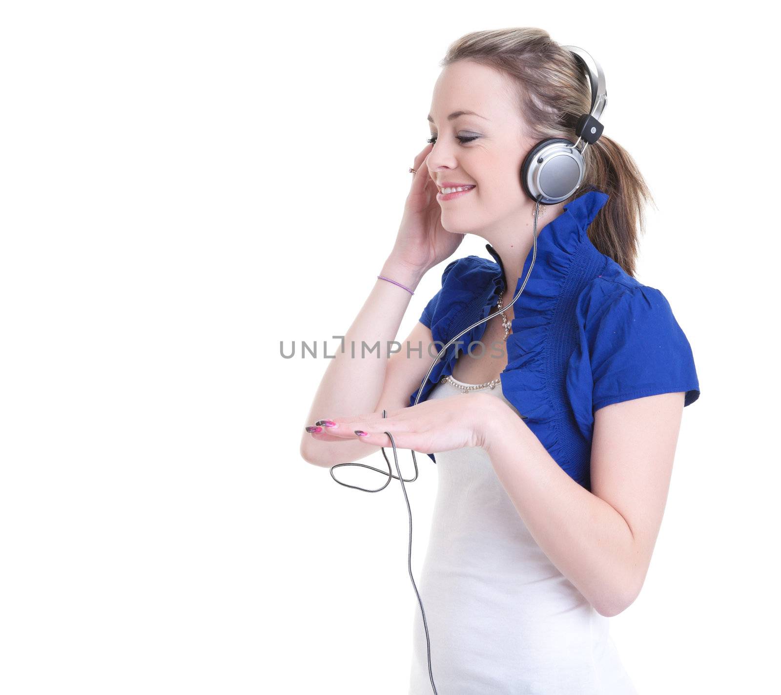 young woman listening to music on heaphone isolated on white background