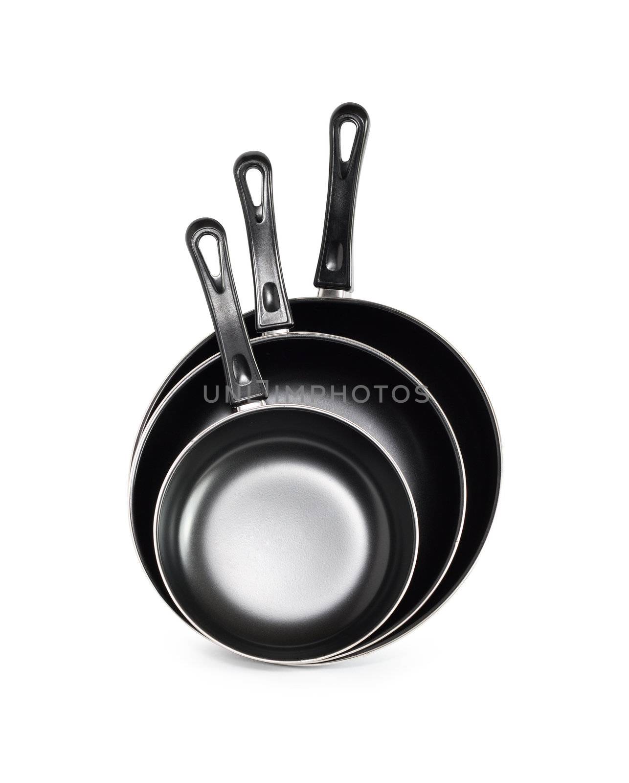 Three new black frying pan on white background. Isolated with clipping path