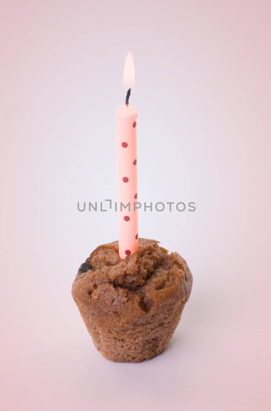 small birthday cake with one candle by clearviewstock