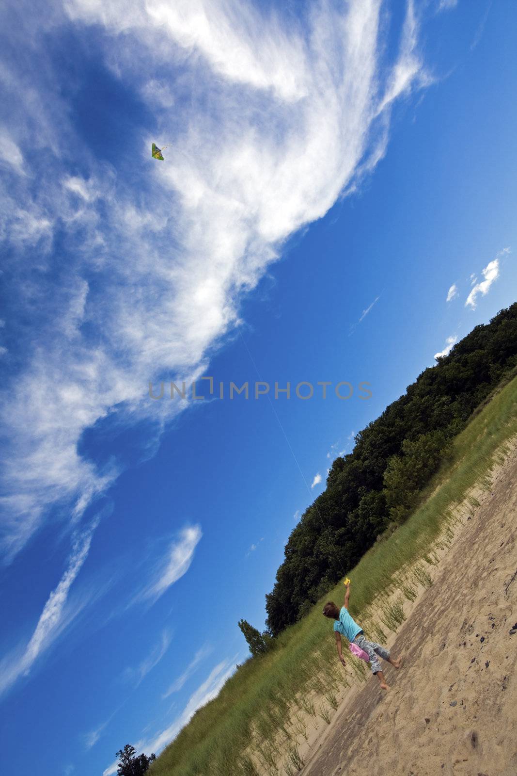 Girl Flying Kites on the beach in Michigan