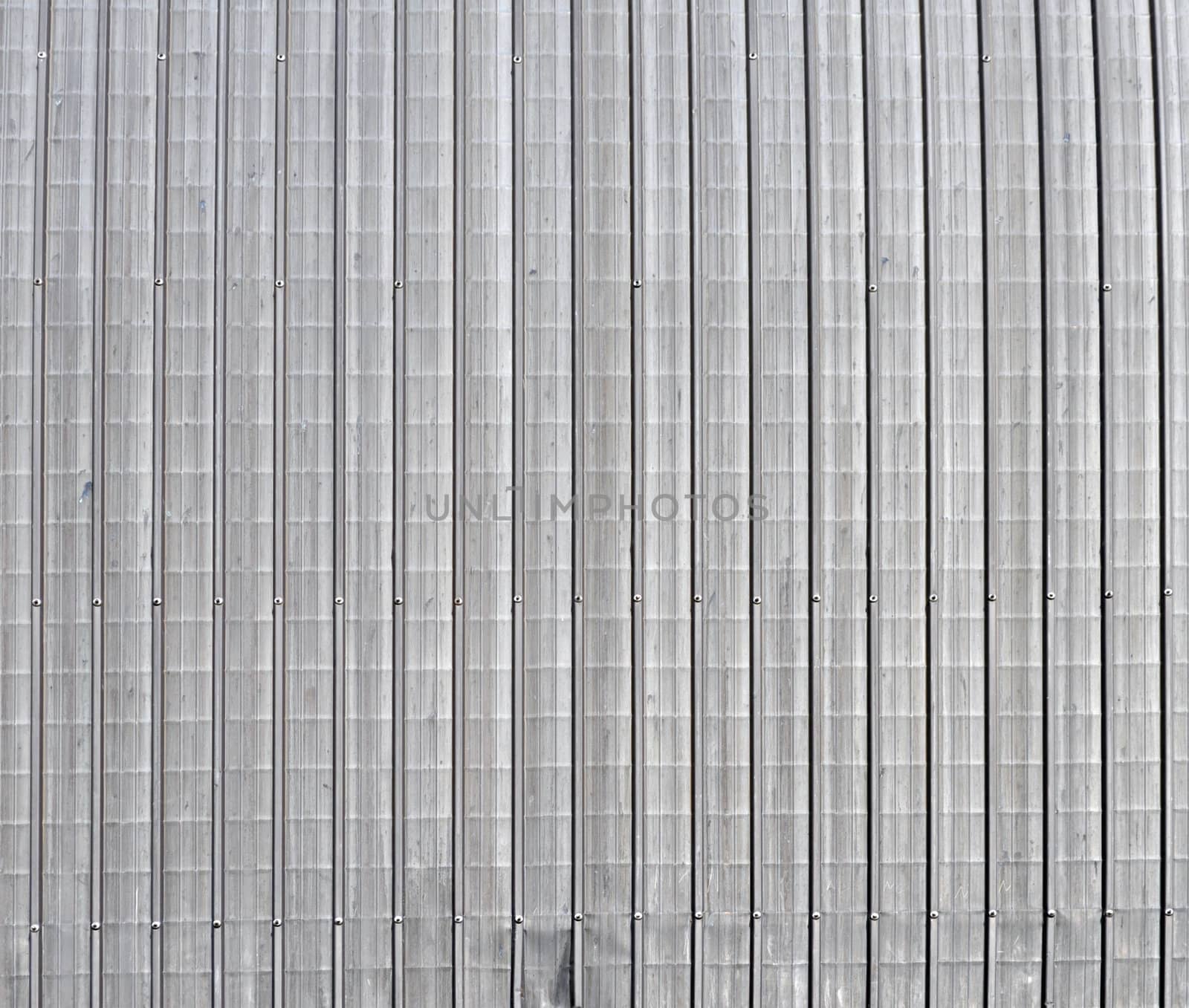 Corrugated steel plate useful as a background