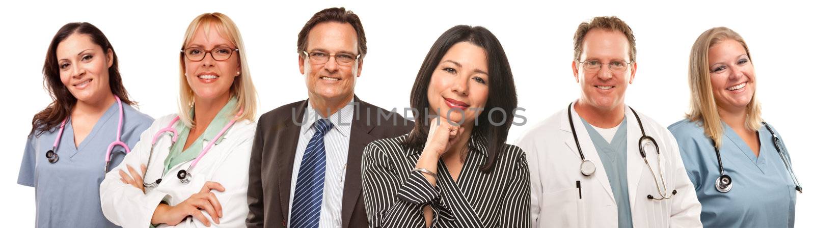 Hispanic Woman and Man with Doctors or Nurses Behind Isolated on a White Background.