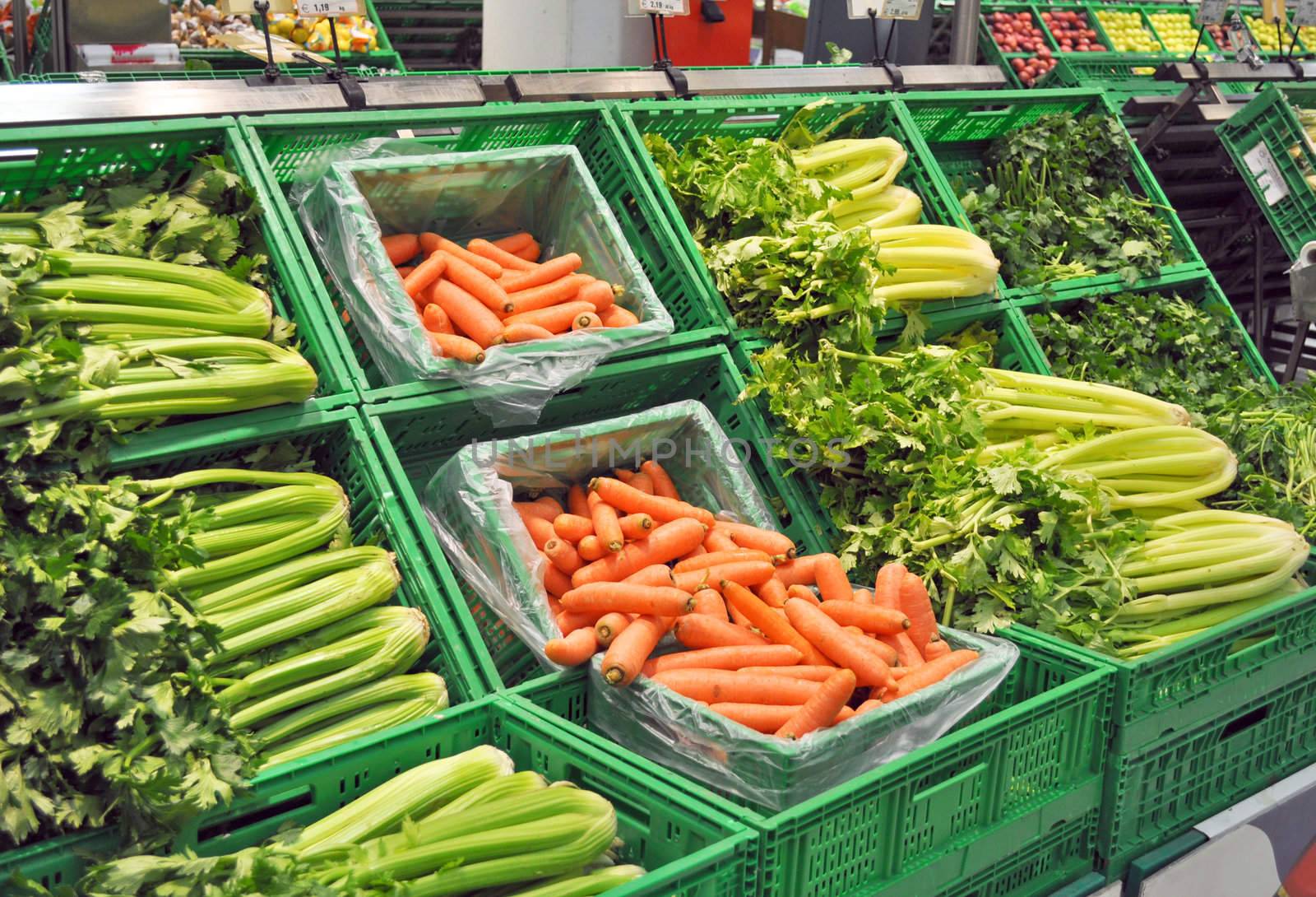 Vegetables at a supermarket, including carrots and celeries