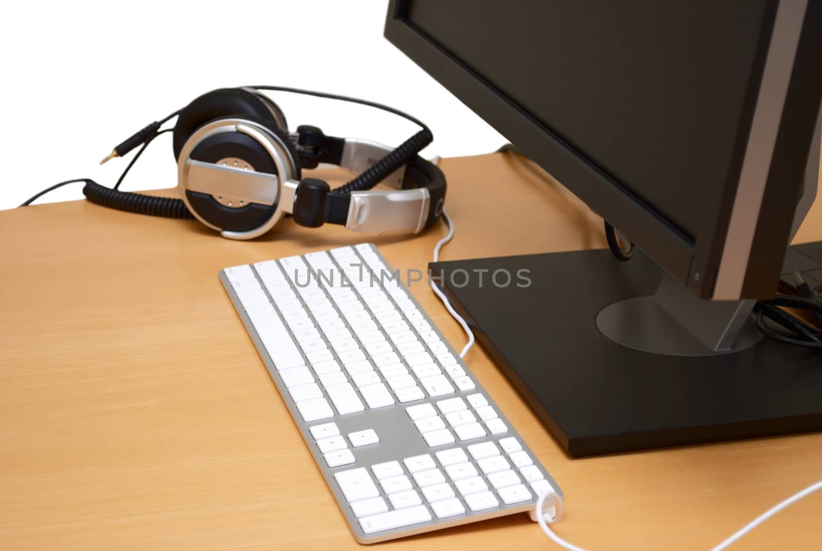 Monitor with headsets in the table, isolated on white