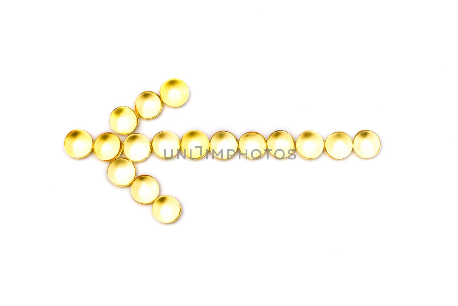 Arrow from yellow capsules on a white background