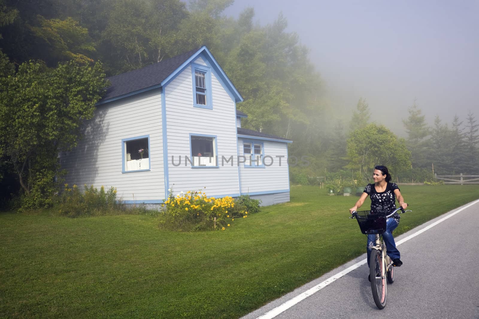 Biking in fog - Mackinac Island, Michigan, USA.