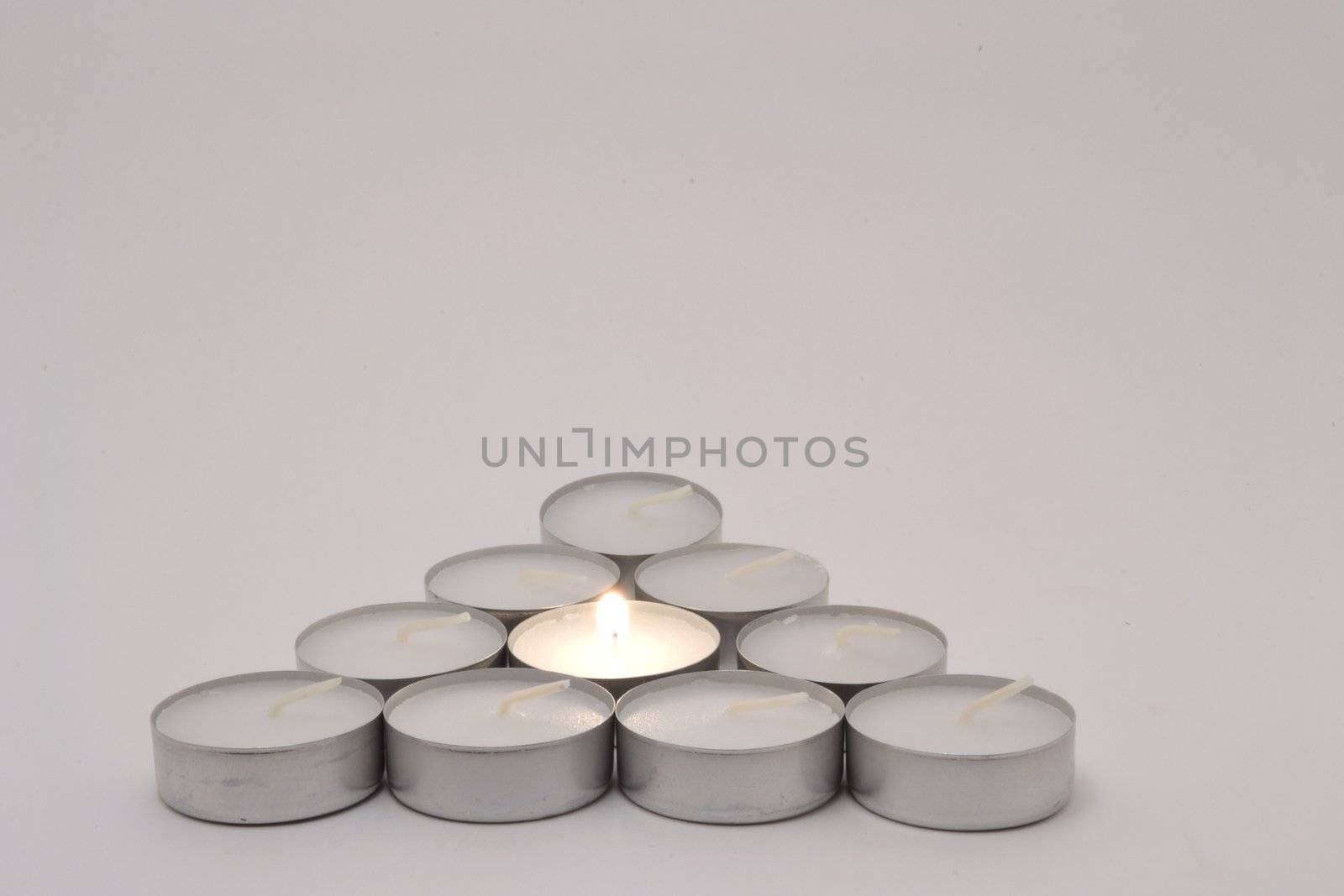 The candle triangle over white background