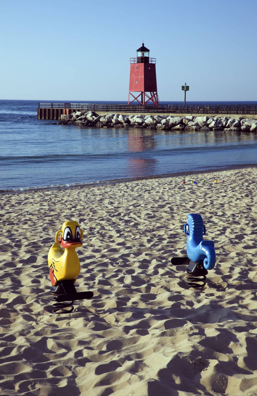Toys on the beach - Charlevoix South Pier, Michigan, USA.