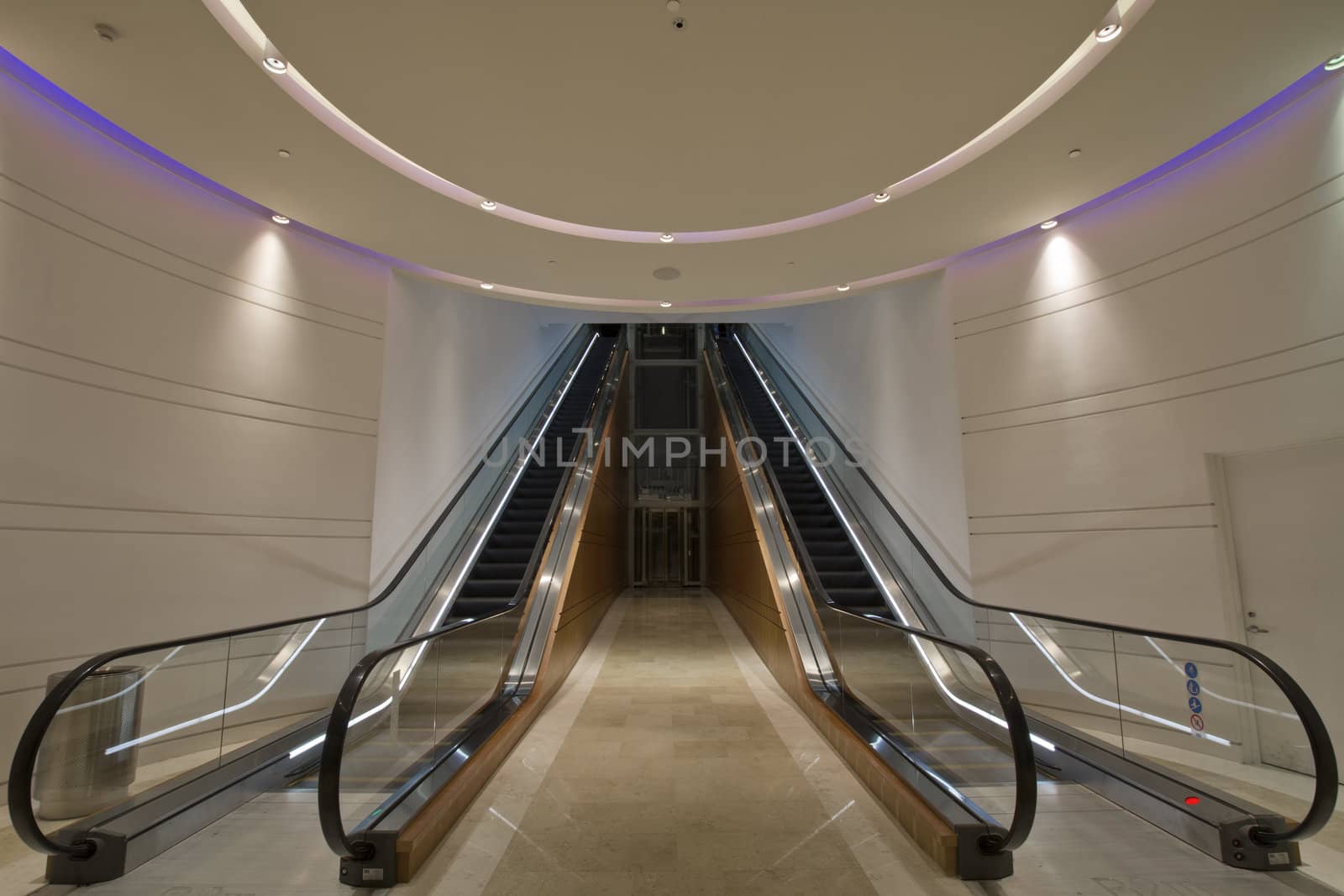 Escalators in Underground Tunnel by Davidgn