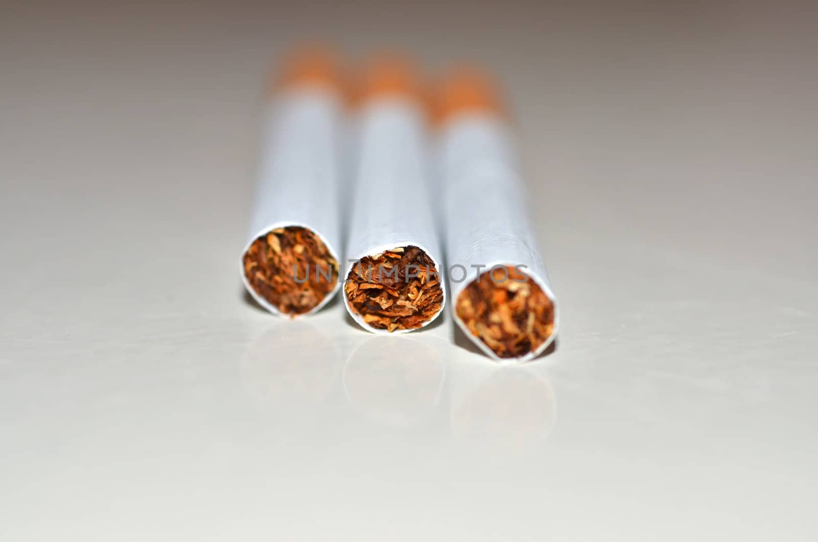 A couple of filter cigarettes.