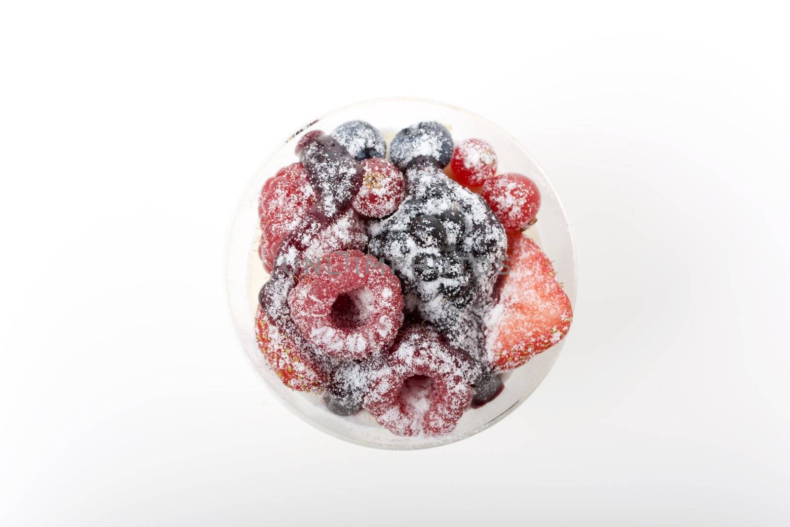 Cup of fresh assorted berries sprinkled with powdered sugar.  