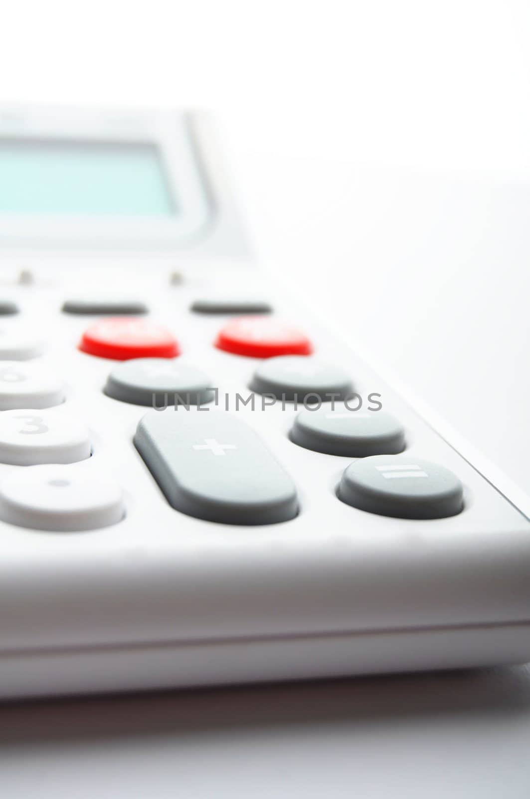 white calculator on office showing financial concept