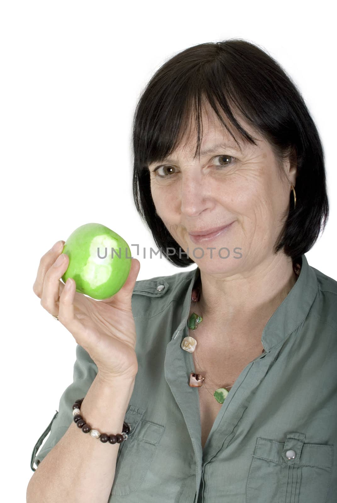 Balanced diet concept shot. Aged woman with fresh apple in her hand.