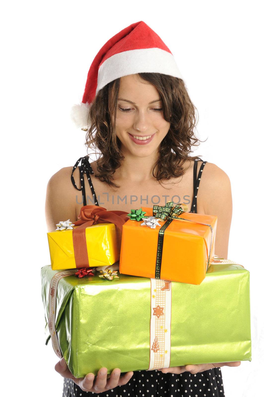 Pretty young woman with christmas gifts by fahrner