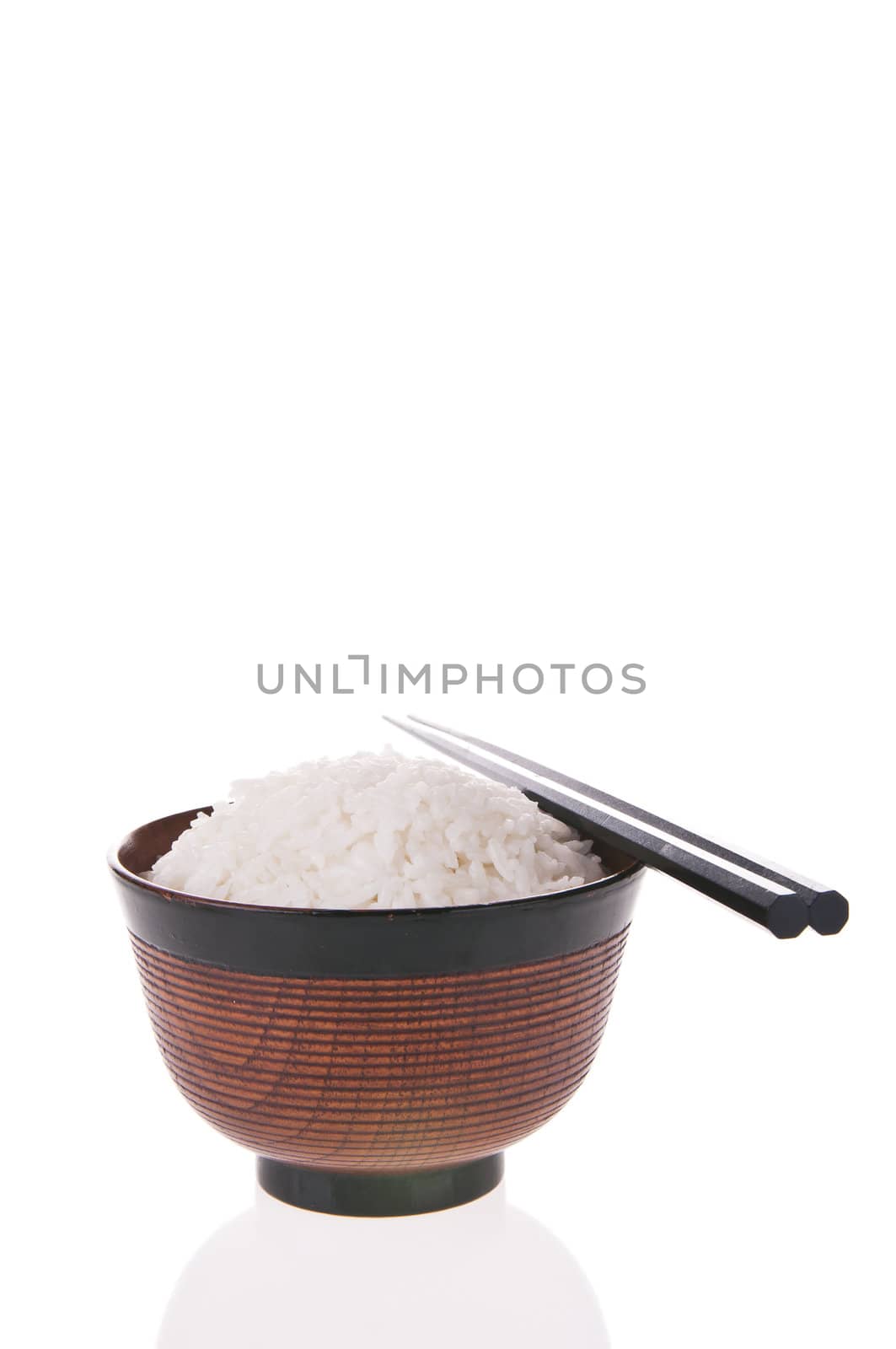 Bowl of cooked rice with chopsticks isolated on white background