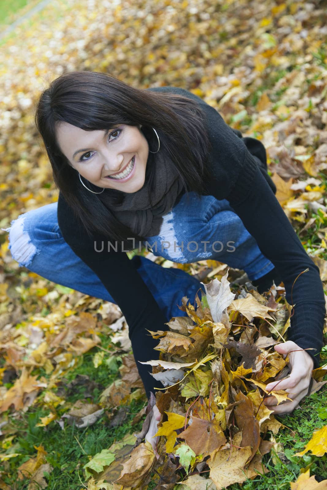 Happy Autumn - smiling girl in the park.