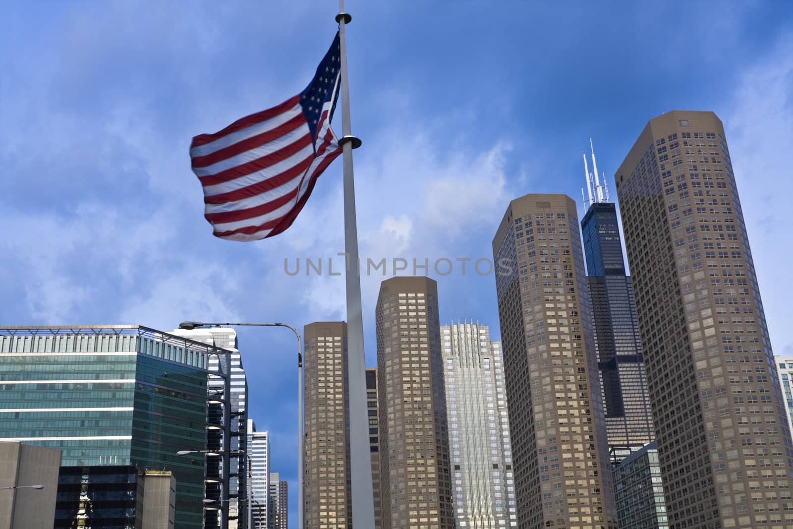 US flag and Presidential Towers in Chicago, IL.